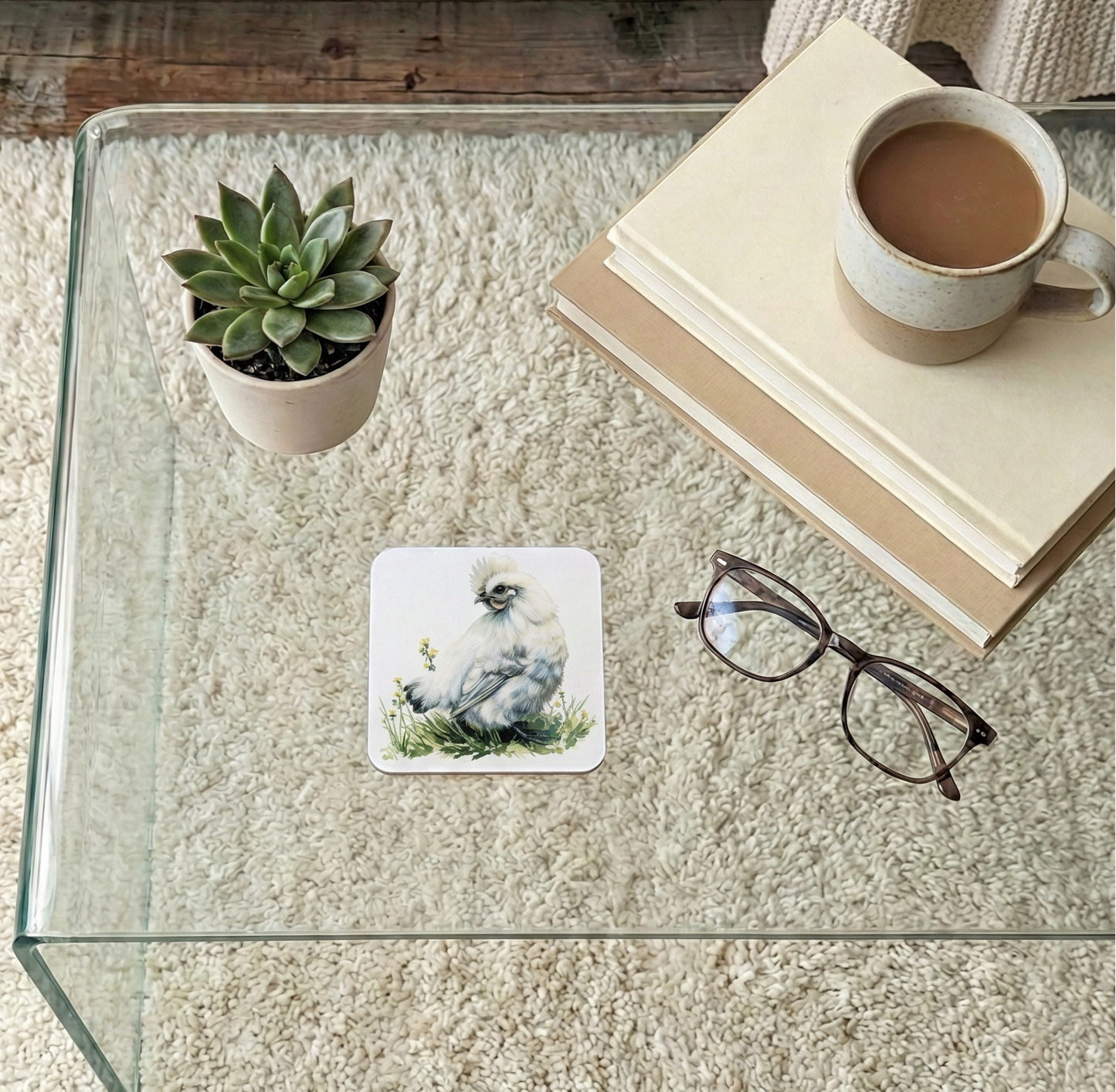 Square coaster featuring a detailed watercolour illustration of a fluffy white Silkie chicken sitting in grass.