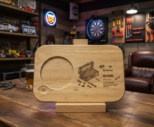 Smooth light wooden serving board, displayed upright, featuring a circular recess and detailed engravings of tools and text.