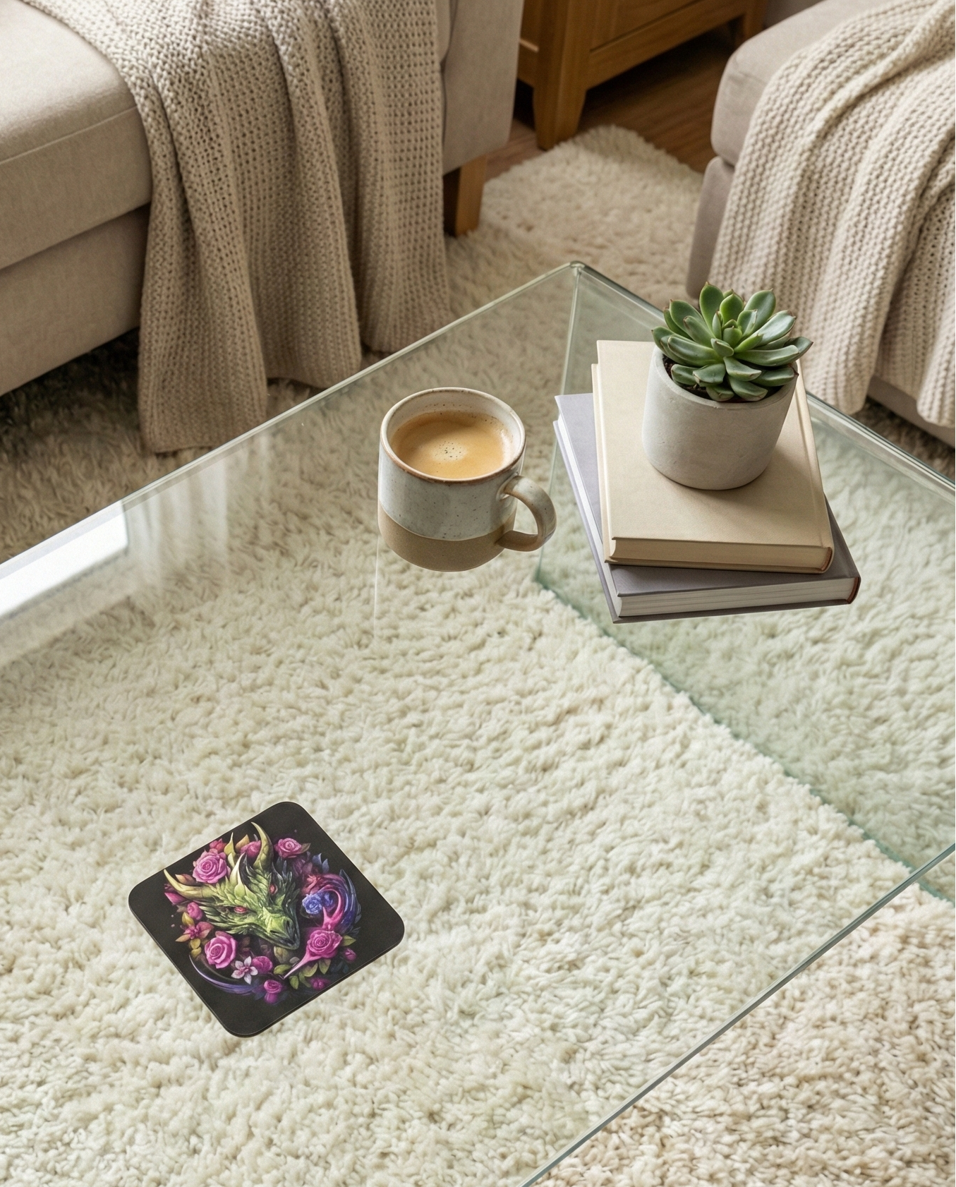 Black coaster featuring a fluorescent yellow-green dragon and vivid pink roses, resting on a glass table above a thick cream rug.