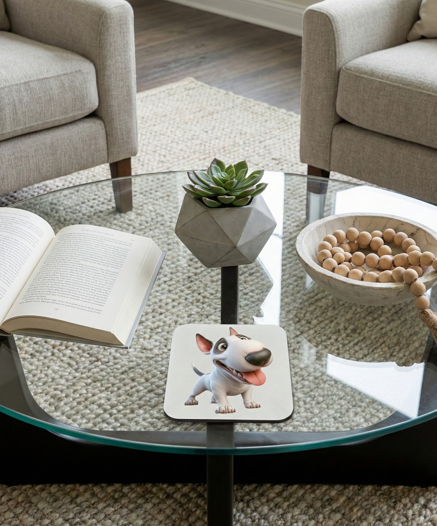 White Bull Terrier dog coaster with a black eye patch and happy expression on a modern glass coffee table.