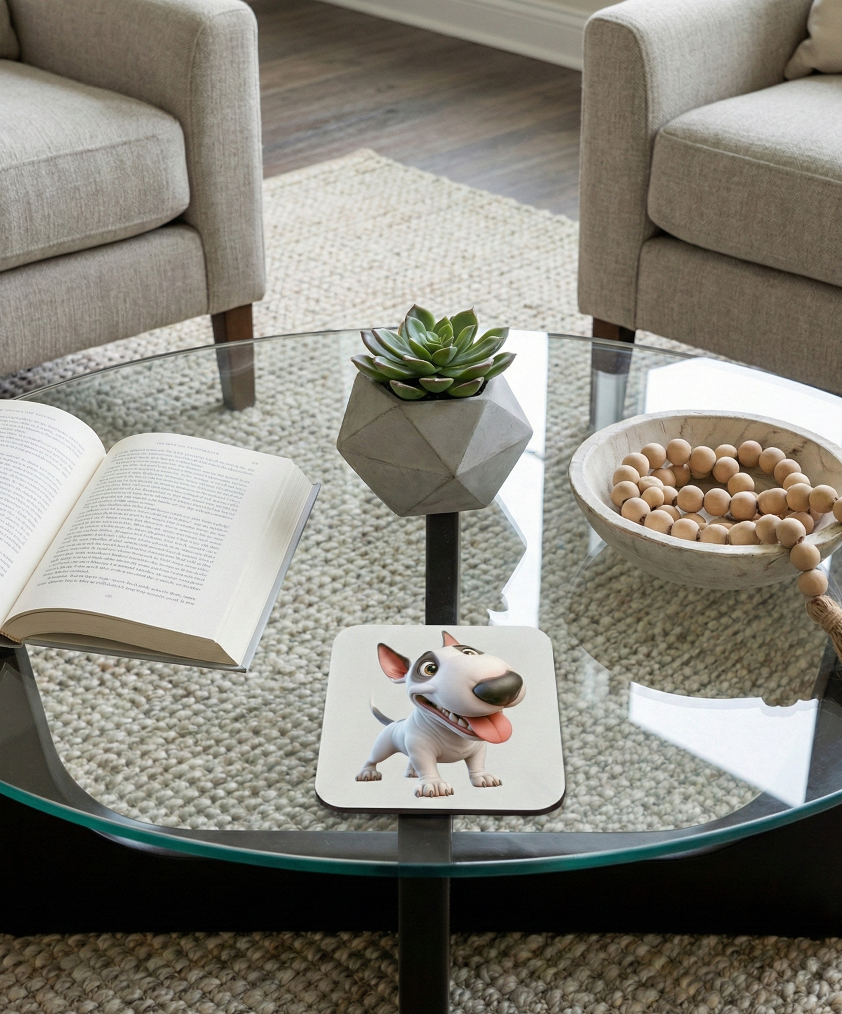 White Bull Terrier dog coaster with a black eye patch and happy expression on a modern glass coffee table.