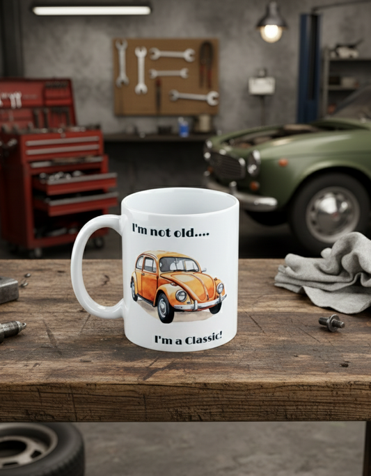 Classic car coffee mug sitting on a wooden workbench in a car garage workshop