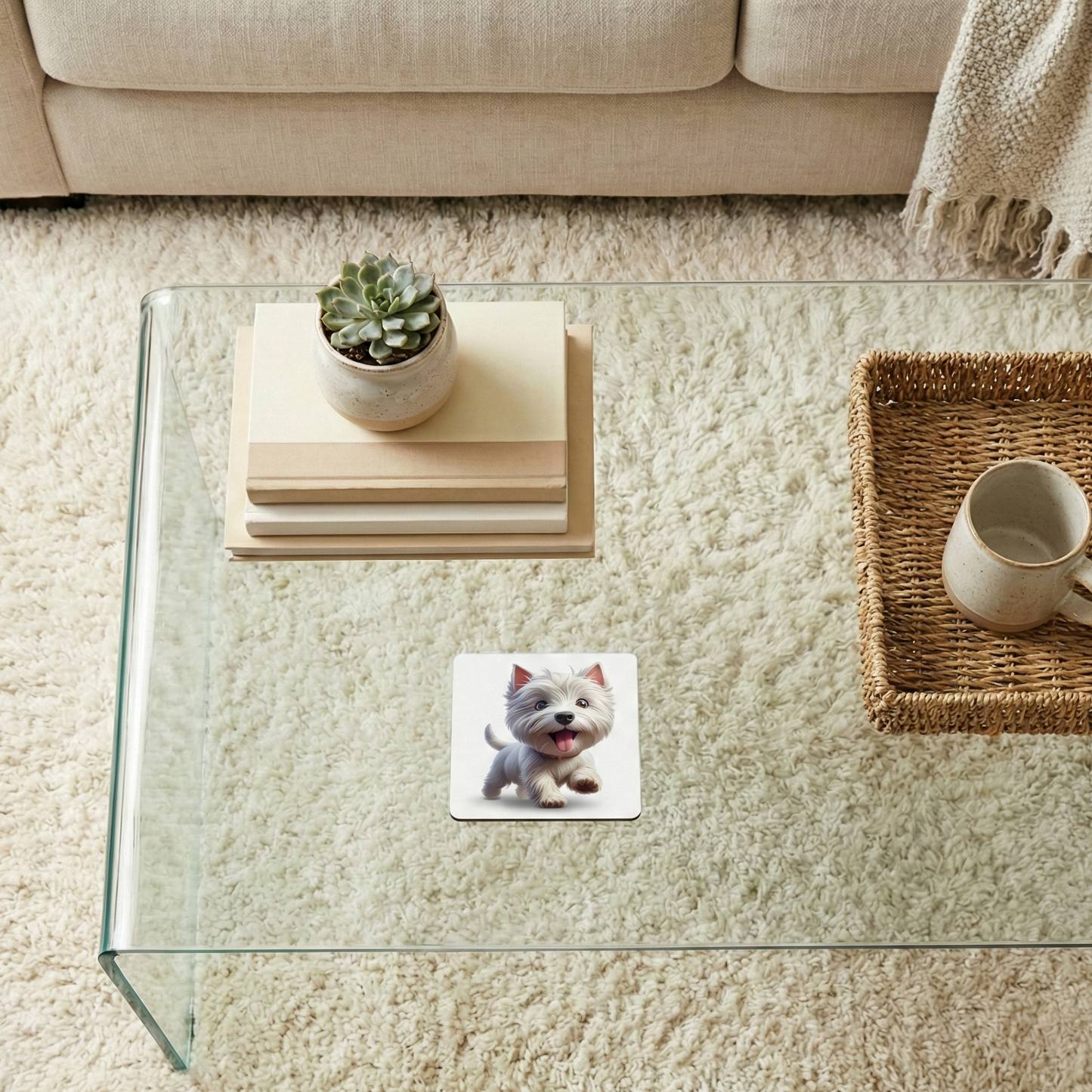 White Westie dog coaster on a glass table. A succulent pot and stack of books sit on a plush cream rug.