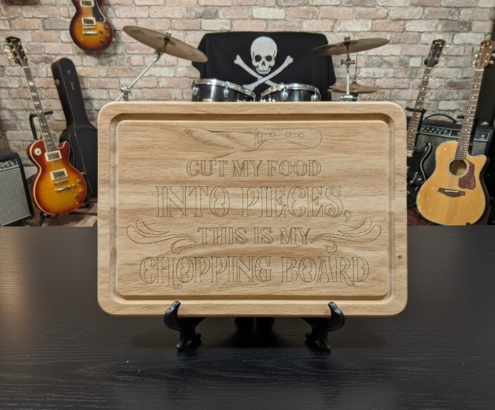 Light wood chopping board with engraved text displayed on a black stand. The chaotic background features guitars and a drum kit.