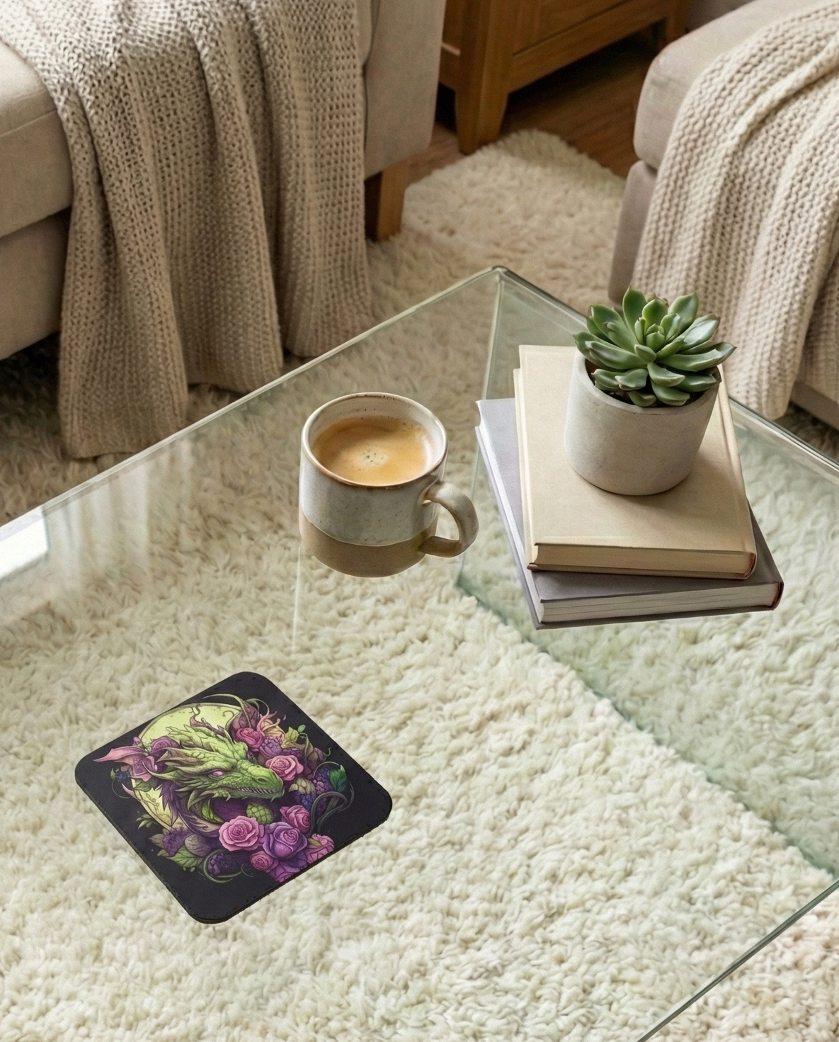Square black coaster featuring a bright green dragon profile and abundant purple and pink roses, resting on a glass table.