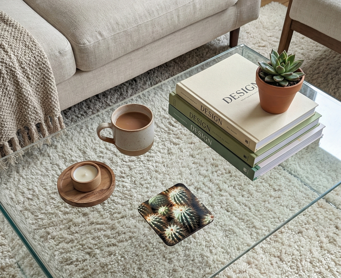 Close-up of a square cactus coaster on a clear glass table, visible over the plush, textured beige shaggy rug.