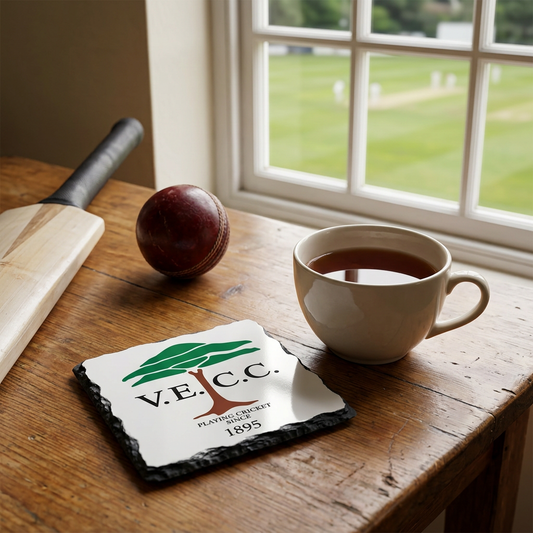 VECC slate coaster rescaled to 10 cm by 10 cm in a cricket pavilion setting